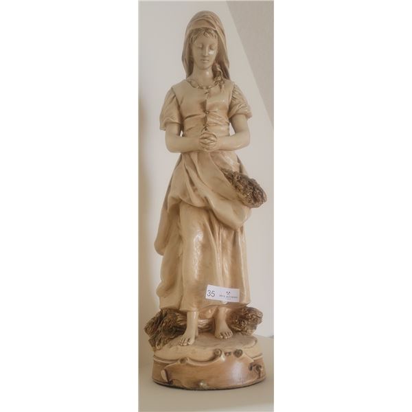 An Statue Of A Young Woman