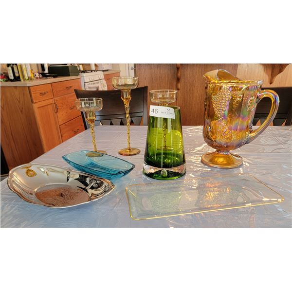 A Delightful Assortment Of Multi-Colored Candle Holders, Water Pitcher, Vases, and Serving Trays