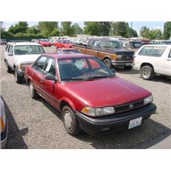 91 TOYOTA COROLLA 4DR EXMT.                                           