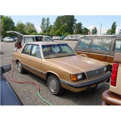 85 PLYMOUTH RELIANT 4DR EXMT.                                         