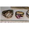 Image 2 : 5 assorted costume jewelry rings - 1 ring has paper claiming a real diamond, but we cannot verify, n