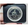 Image 2 : 1975 Calgary Centennial Silver Dollar. Popular cowboy on bucking bronco. Housed in its original blac