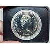 Image 3 : 1976 Library of Parliament Silver Dollar. Housed in its original black clamshell case of issue. Spec