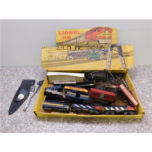 Box of Vintage Lionel HO Train Pieces and Track + Capgun and Holster