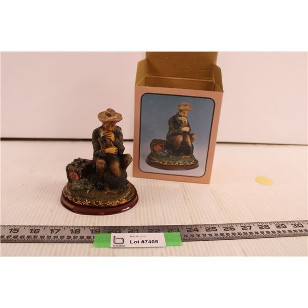 Man with Dog Figurine