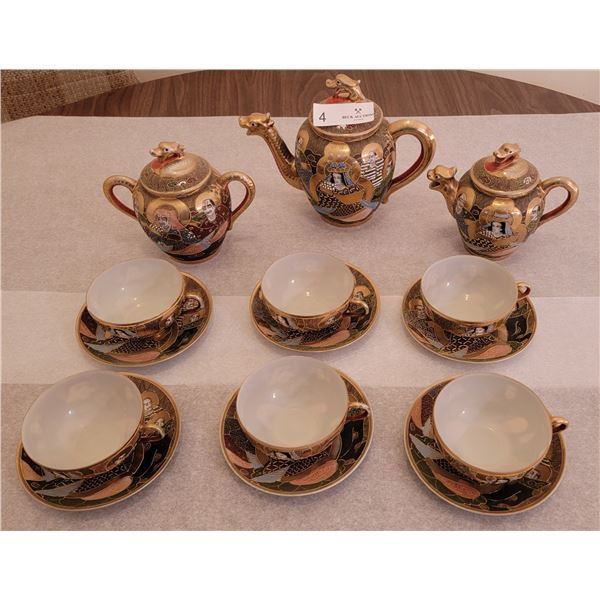 A Beautiful Tea Set With A Chinese Aesthetic ( Tea Pot, Creamer, Sugar, Cups, And Saucers )