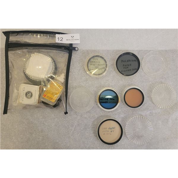 An Assortment Of Camera Lenses/Cleaning Supplies