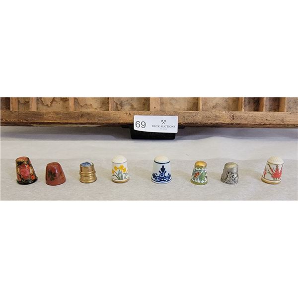 A Charming Vintage Shelf With An Assortment Of Gorgeous Collection Of Thimbles