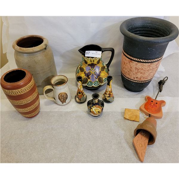 A Huge Assortment Of Porcelain Vases With A Wind Chime