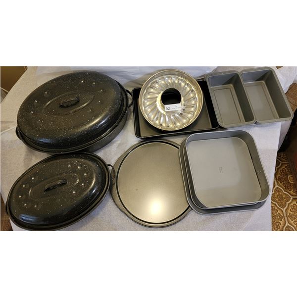 A Huge Assortment Of Bake Ware ( Roasting Pans, Baking Pans, Pizza Pans etc. )