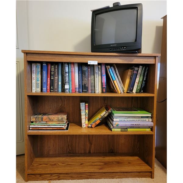 A Book Shelf/T.V., With An Assortment Of Good Books ( Robin Hood, Alice/Wonderland 2, R. Crusoe )
