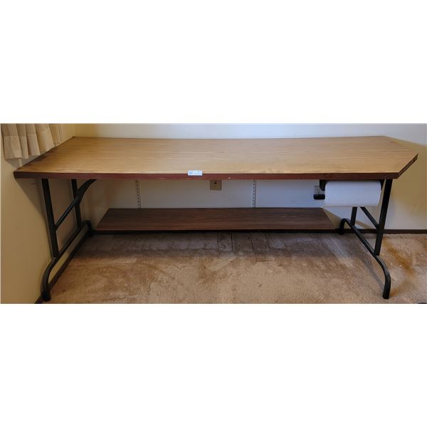 A Sturdy Fold Out Table ( Wooden) With Paper Towel Dispenser Attachment