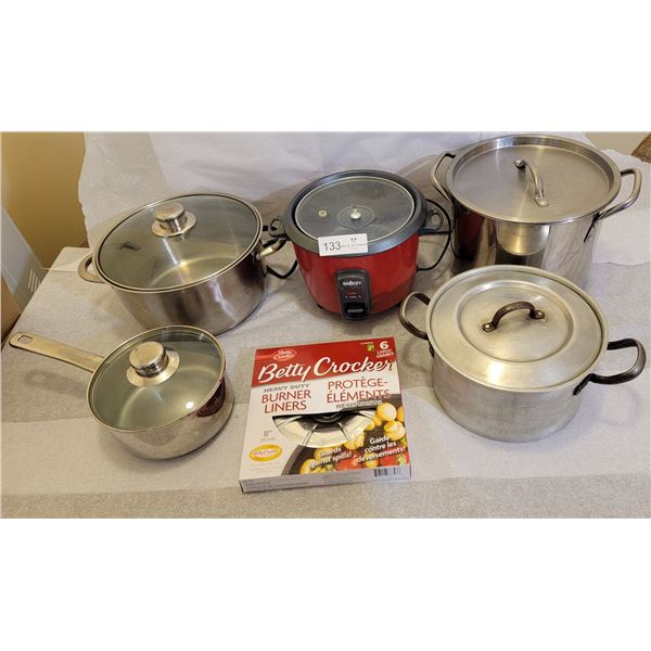 A Red And Wonderful Rice Cooker With An Assortment Of Pots