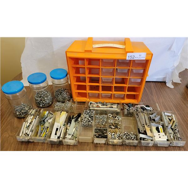 An Orange Nail Kit With An Enormous Assortment Of Nails,Screws and Nail-like Components