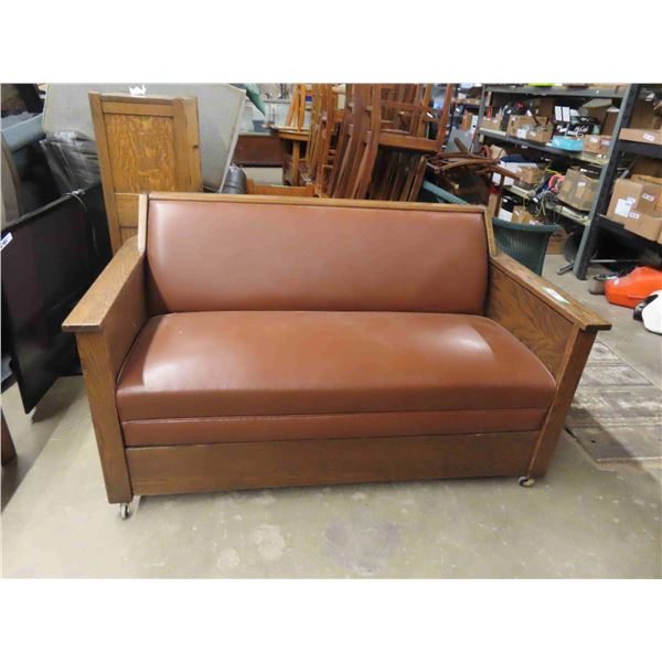 Vintage Antique Oak Settle.  It pulls out to a bed- refinished and new leather like upholstery