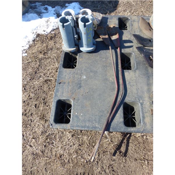 4- steel tractor axle spacers and 2- swather rods