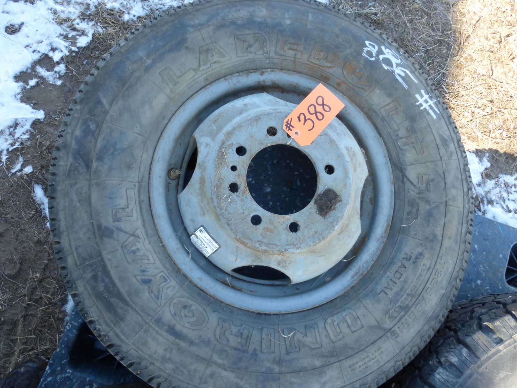 1- 235 85 16 tire & 8-hole rim and 1- 245 75R16 tire and rim