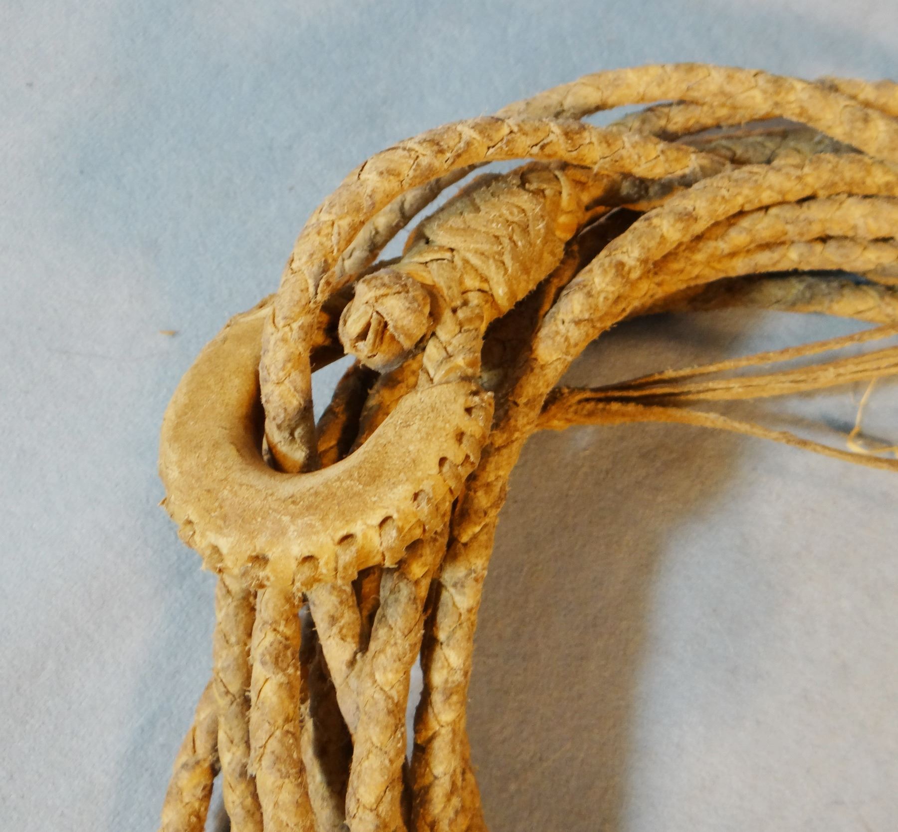 Rawhide riata, 32', shows that it has been used, hondo leather covered