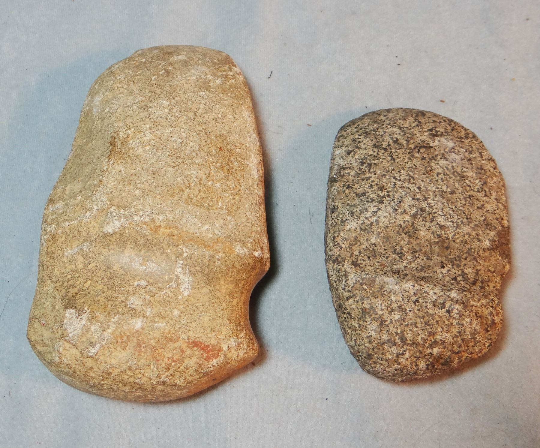 (2) grooved stone axes 1 is from Wyoming massacre grounds, 7" x 4" & 1 is from Illionois, 5" x 3"