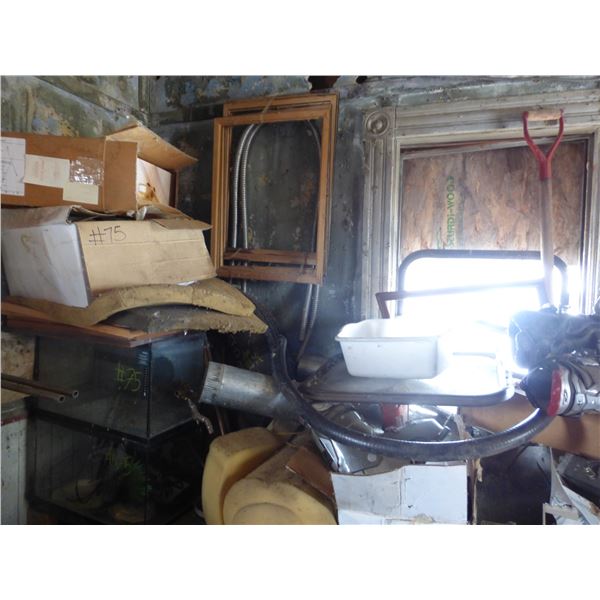 Misc. on west side of bldg- Oars, rads, motor parts, golf clubs etc.