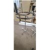 Image 2 : TWO CAROUSEL APPAREL RACKS DIA 27 1/2" MAX HEIGHT 61" MIN HEGHT 45" HAS ALL WHEELS