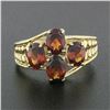 Image 2 : 10k Yellow Gold 3.50 ctw Prong Set Oval Cut Garnet Open Work Sides Wide Band Rin