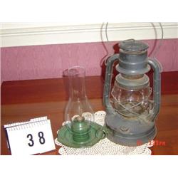 2 LANTERNS - (1) 11" TALL GREEN METAL WITH CLEAR GLOBE, AND (1) 13" TALL GRAY METAL HANGING LANTERN