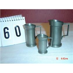 PEWTER MINIATURE SET OF GRADUATED PITCHERS