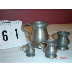 PEWTER SET OF 4 MINIATURE PITCHERS