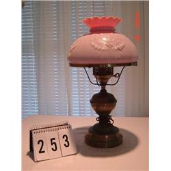 BRUSH BRONZED BASE LAMP WITH PINK GLASS SHADE WITH RAISED EAGLE MOTIF AND FLUTED EDGE