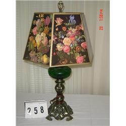 METAL BASE LAMP WITH GREEN GLASS CENTER AND BLACK BACKGROUND SHADE WITH FRUIT AND FLOWERS
