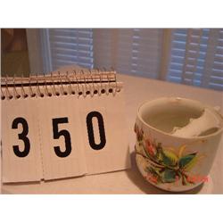 MUSTACHE CUP - white porcelain with fine gold trim and flower & leaf on white