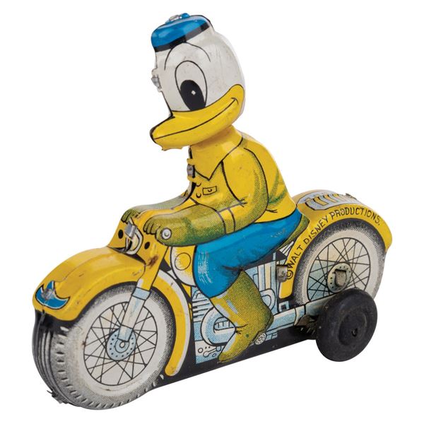 A Donald Duck on Motorcycle Tin Toy.