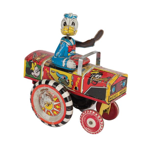 A Donald Duck Dipsy Car Tin Toy.