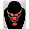Image 1 : 17" BRASS TONE CRATER TEXTURE STATEMENT BIB