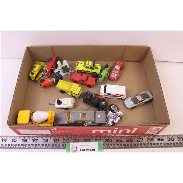 Assorted toy cars and trucks