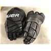 Image 2 : Group of assorted hockey items - includes Bauer 15" & 14" ice hockey gloves/ 1 shin pad/ 1 Road Warr