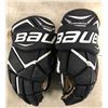 Image 3 : Group of assorted hockey items - includes Bauer 15" & 14" ice hockey gloves/ 1 shin pad/ 1 Road Warr