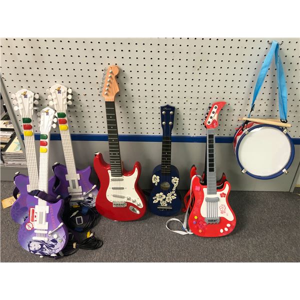 Group of assorted kids' guitar toys w/ drum & stick