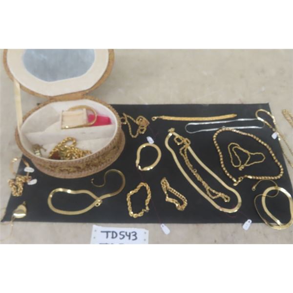 Jewelry Box with Many Gold Colored Necklaces