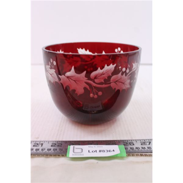 Red bowl with leaves on it