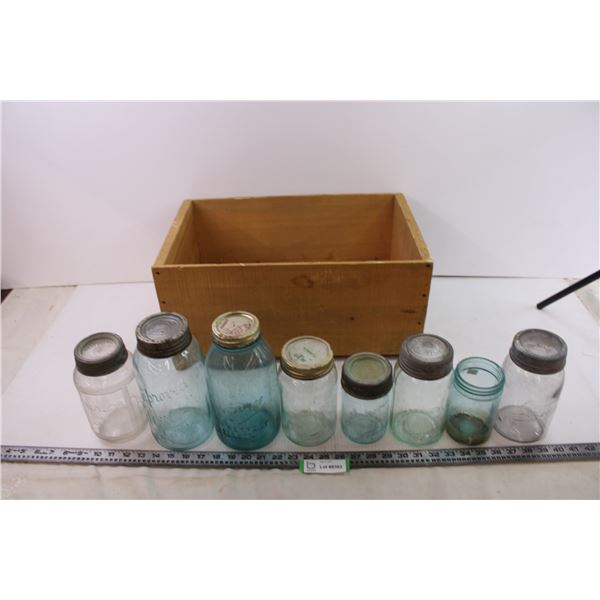 8 glass jars in varies sizes and wooden crate