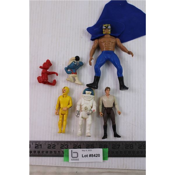 Action figures smurf and Donald duck and han solo