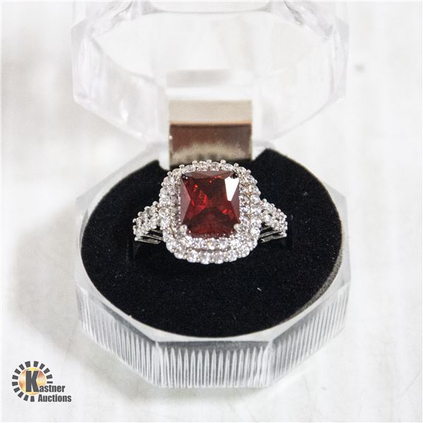 SIZE 7.5 RING STAMPED 925 WITH RED MIDDLE STONE