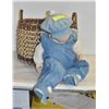 Image 1 : PORCELAIN DOLL IN BASKET
