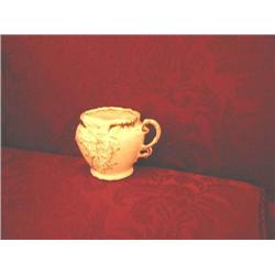 Mustache cup in white porcelain w/applied gold and rose tint