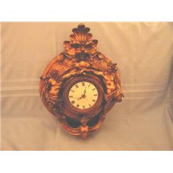 Quartz movement clock in gold tone resin with classical figures - 18" x 12"