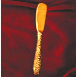 Eleven silverplated spreaders w/gold washed blades in "Repousee"