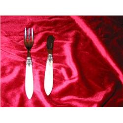 8 each of Napoleon spreaders & cocktail forks w/pearlized ivory handles & stainless blades