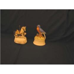 2 Porcelain musical figurines - one is a carousel horse playing "Carousel Waltz" & the other is a bi